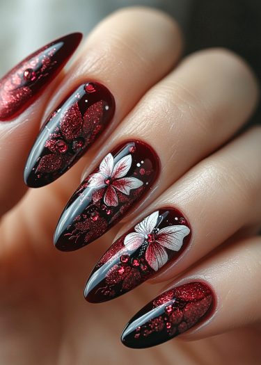 Elegant maroon butterfly nail art with floral design and shimmering accents for a stunning look.