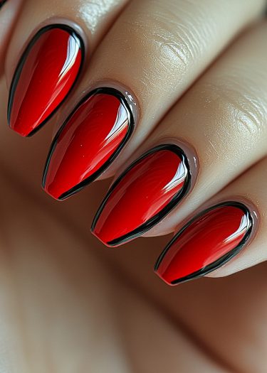 Elegant red nail art with black outlines on almond-shaped nails for a bold look.