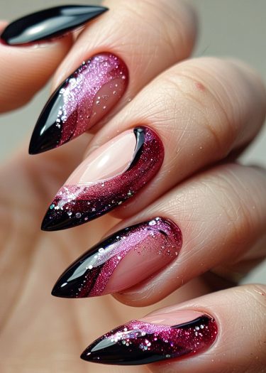 Stunning almond-shaped nails with black and magenta ombre design featuring glittery accents.