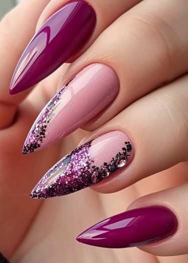 Elegant stiletto nail design featuring magenta and pink gradient with stunning glitter accents.