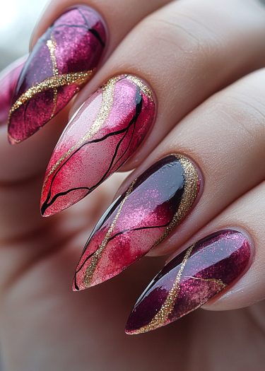 Elegant almond-shaped stiletto nails featuring colorful gradients, black patterns, and shimmering gold accents.