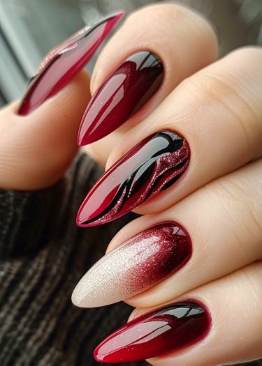 Elegant stiletto nails featuring burgundy, black, and glittery white designs for stunning nail art.