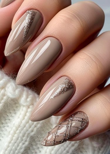 Sophisticated taupe stiletto nails with glitter accents and lattice design for an elegant look.