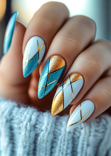 Elegant teal and gold geometric nail art on almond-shaped nails against a cozy backdrop.