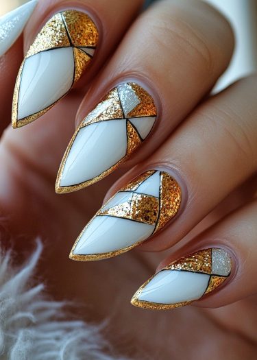 Stunning geometric nail art featuring white base, gold and silver glitter on almond-shaped nails.