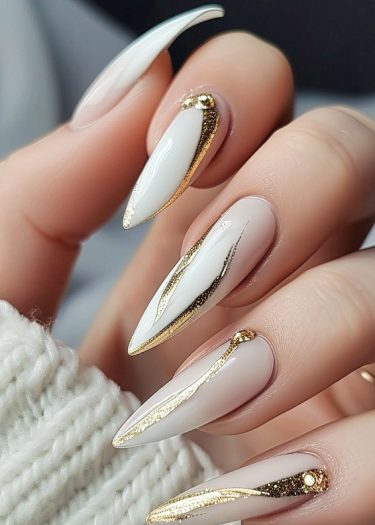 Elegant white and gold nail art with intricate designs and luxurious accents.