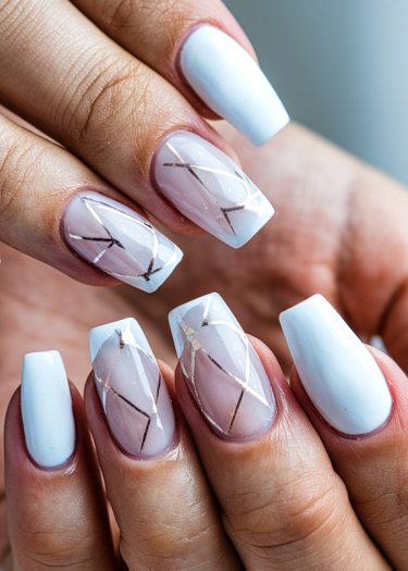 Elegant white manicure with geometric accents, showcasing stylish square nails and glossy finish.