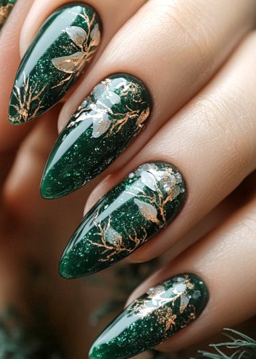 Luxurious emerald nails with gold and silver botanical designs, perfect for elegant occasions.