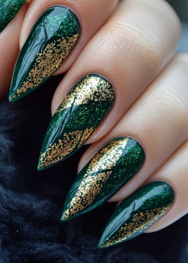 Elegant emerald green nails with gold glitter for a stunning and sophisticated manicure.