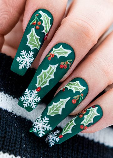 Festive green nail art featuring holly leaves and snowflakes for holiday celebrations.