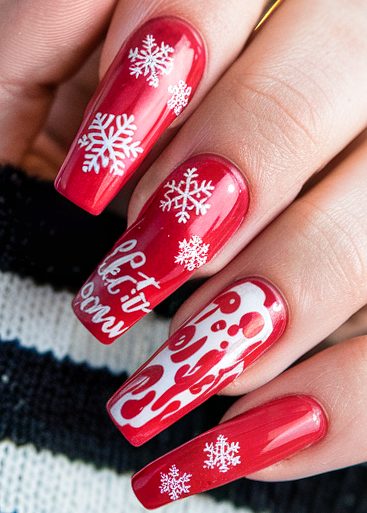 Festive red nails with intricate white snowflakes and Let it snow design for holiday cheer.