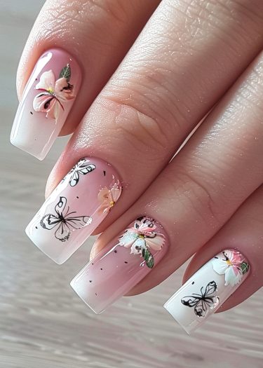 Elegant floral and butterfly nail design with a soft pink and white gradient background.