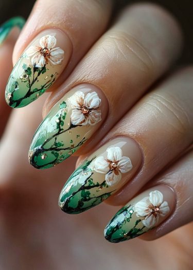 Beautiful floral gradient nail art with intricate designs and gold accents for elegant manicures.