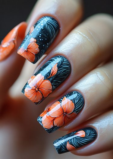 Elegant floral nail art with vibrant orange hibiscus flowers and glossy black background.