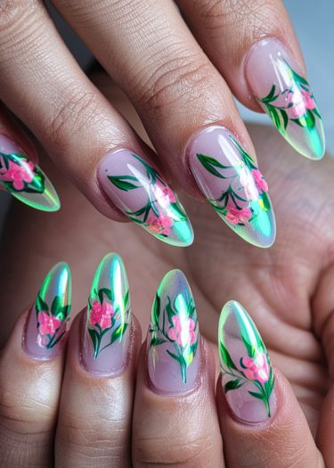 Elegant floral stiletto nail art featuring pink flowers on a nude background.