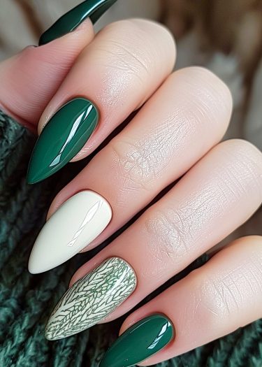 Elegant forest green and ivory stiletto nails with intricate fern designs.