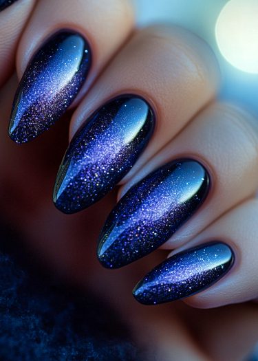 Stunning galaxy-themed manicure with glittering cosmic nails in a vibrant color gradient.