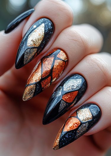 Stunning geometric black nail art with vibrant glitter, perfect for bold fashion statements.