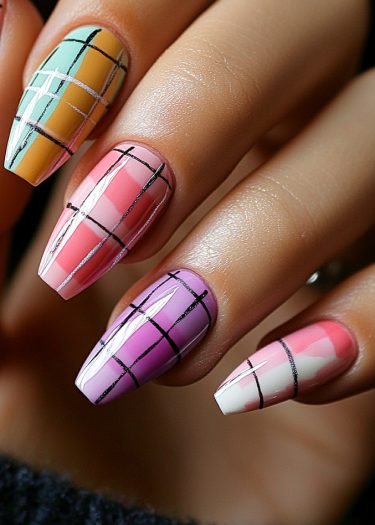 Vibrant coffin-shaped nails featuring artistic plaid designs and glossy finishes in various colors.