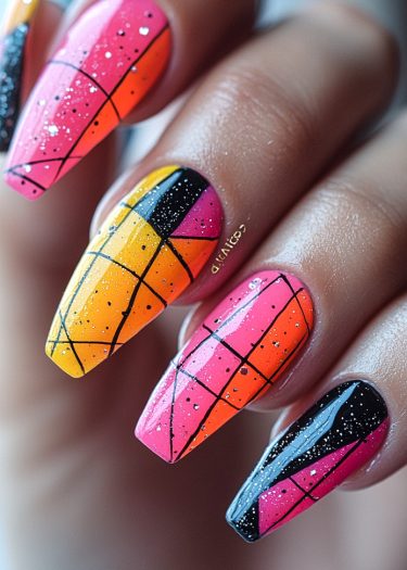 Vibrant geometric nail art design in coffin shape with bold colors and intricate patterns.