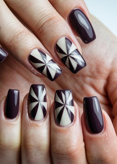 Elegant plum nails with geometric white design for a modern manicure.