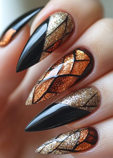 Sophisticated geometric stiletto nails with black and metallic hues, perfect for bold glamour.