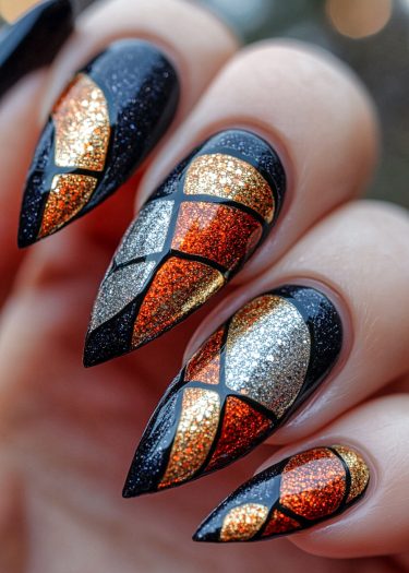 Stunning stiletto nails featuring intricate geometric designs in metallic shades and glitter.