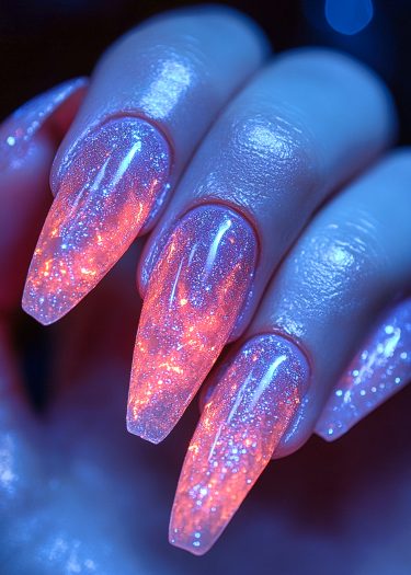 Stunning shimmering stiletto nails with a cosmic gradient design and dazzling glitter finish.