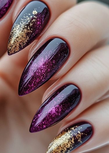 Elegant stiletto nails with dark purple gradient glitter for a glamorous manicure look.