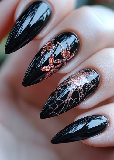 Elegant black stiletto nails with shimmering copper-red nail art and intricate designs shine brilliantly.