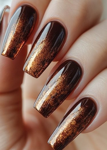 Elegant glossy brown and copper ombre nail art for a sophisticated, trendy look.