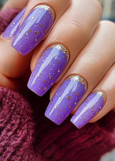 Elegant lavender nails with gold star designs and glittery cuticles on a burgundy background.