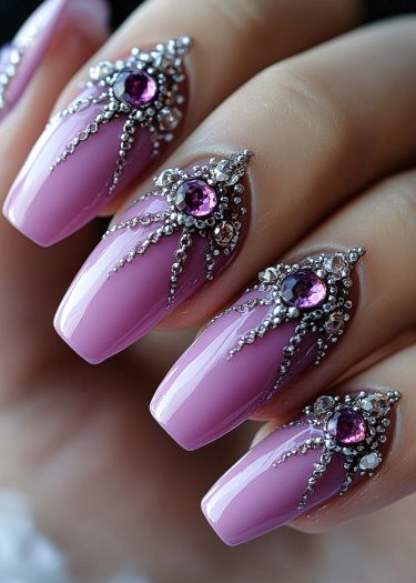 Gorgeous lilac nails with shimmering silver accents and purple gemstones create a stunning manicure.