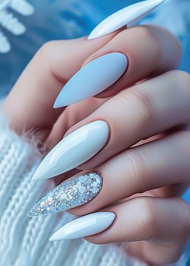 Elegant stiletto white nails with shimmering glitter accent for a chic, sophisticated look.