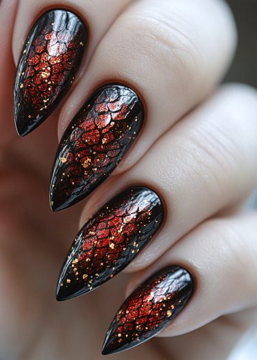 Gothic dragon nail art features fiery stiletto nails with black, red, and gold molten designs.