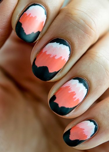 Abstract gradient nail art featuring vibrant coral, pink, black, and white designs.