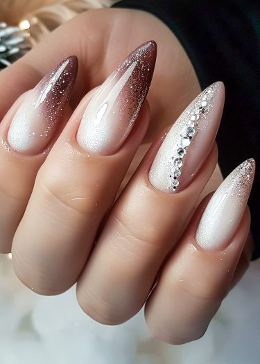 Elegant gradient brown almond nails with rhinestones, perfect for festive occasions.