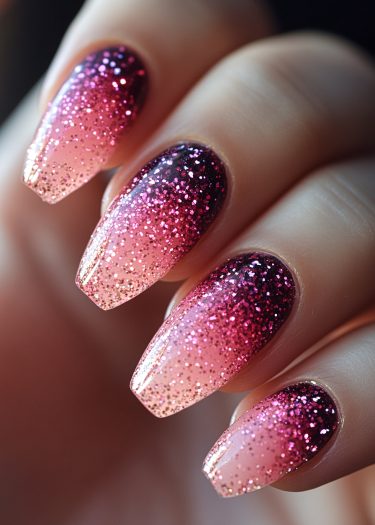 Elegant maroon to peach gradient nails with glitter, showcasing chic almond shape and professional artistry.