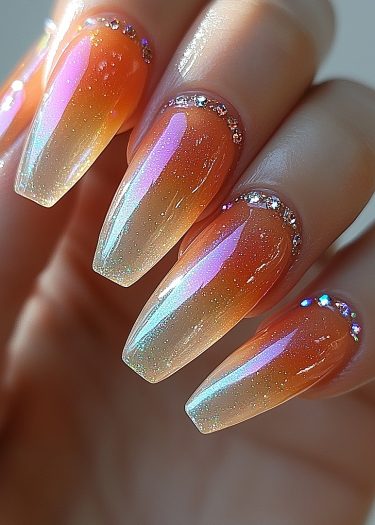 Elegant almond-shaped gradient glitter nails with rhinestones and holographic shine.