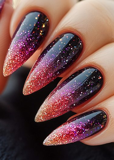 Stunning stiletto nails with gradient colors and glitter for a glamorous look.