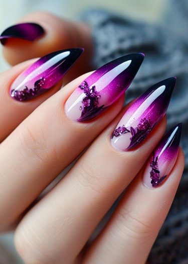 Elegant stiletto nails featuring a stunning pink to purple ombre gradient with intricate designs.