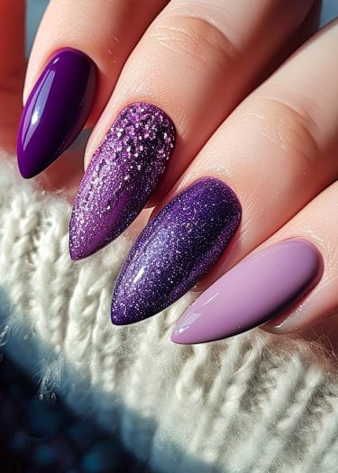 Elegant gradient purple nails with glitter and chic almond shape design.