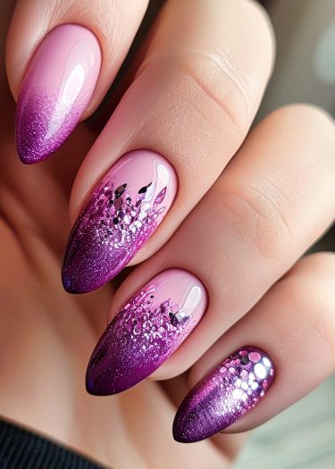 Elegant almond-shaped gradient nails in pink and purple with glitter and intricate designs.