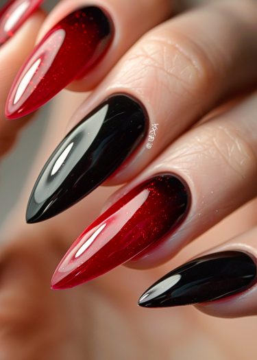 Elegant almond-shaped nails featuring a striking black and red ombre design with glitter.