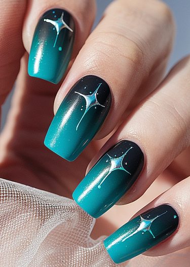 Elegant turquoise gradient nail art with intricate star designs and a glossy finish.