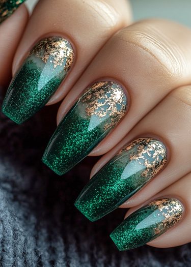 Elegant coffin nails feature a deep green gradient with gold foil accents.