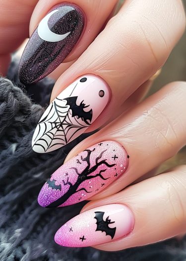 Halloween nail art set featuring spooky designs, bats, moons, and a whimsical twilight sky.