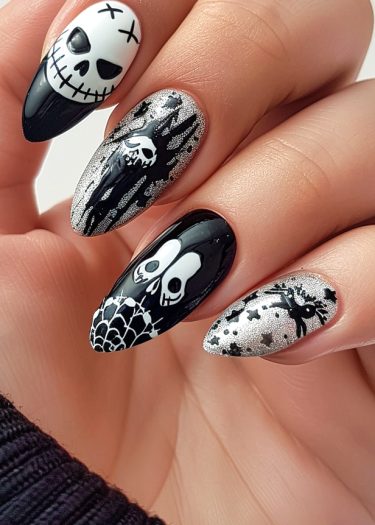 Elegant Halloween acrylic nails featuring spooky designs like skulls, ghosts, and haunted forests.