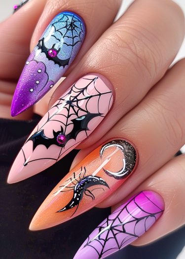 Halloween-themed nail art featuring intricate designs of bats, spiderwebs, and moons.