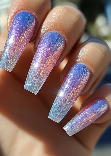 Stunning holographic chrome nails in violet and blue with a chic square-tip design.